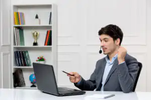 customer service cute guy grey suit with computer headset holding fists up 1 customer service cute guy grey suit with computer headset holding fists up 1