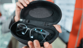 hand holds glasses eyeglass holder as customer s hand selects 1 wordpress website development